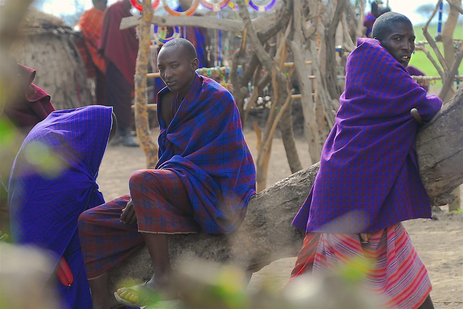 Villagers gathered outside a Maasai homestead